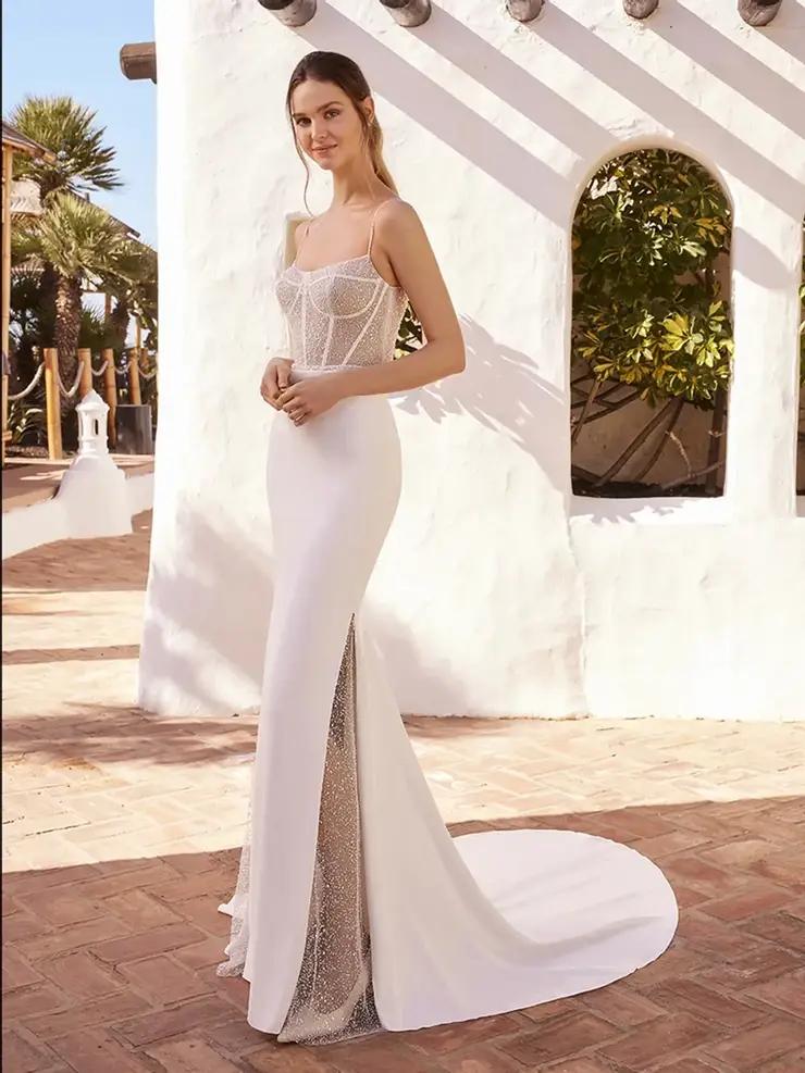 Model wearing a white gown