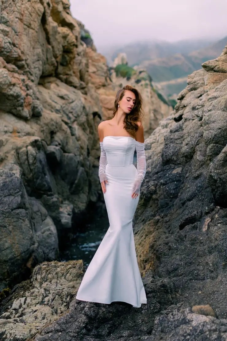 Сouple wearing a white gown and a black suit