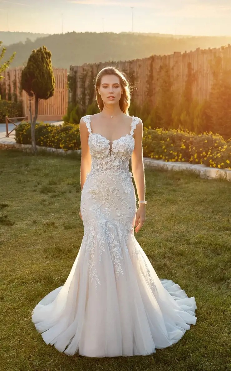 Model wearing a bridal gown on the grass