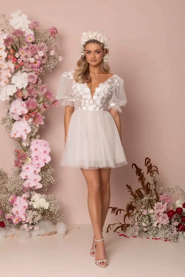 Model wearing a white dress