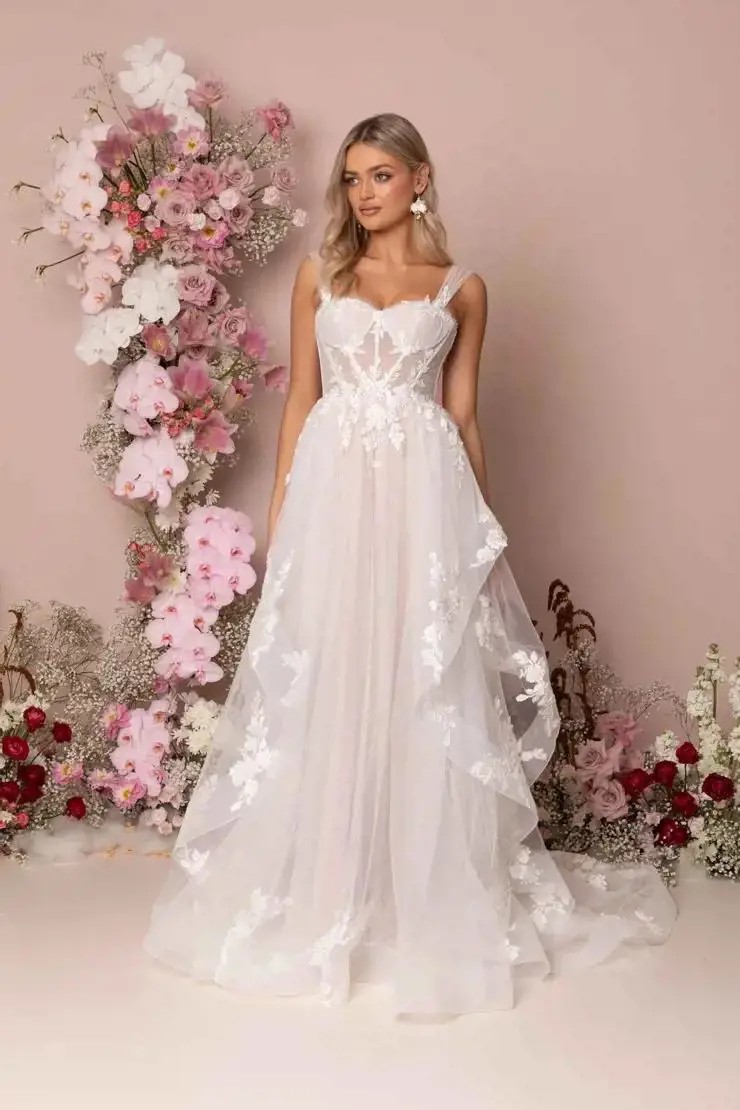 Model wearing Madi lane wedding dress