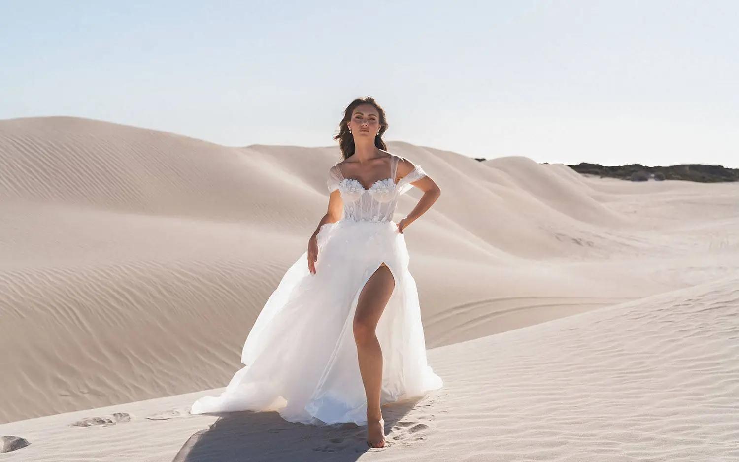 Model wearing Madi Lane wedding dress