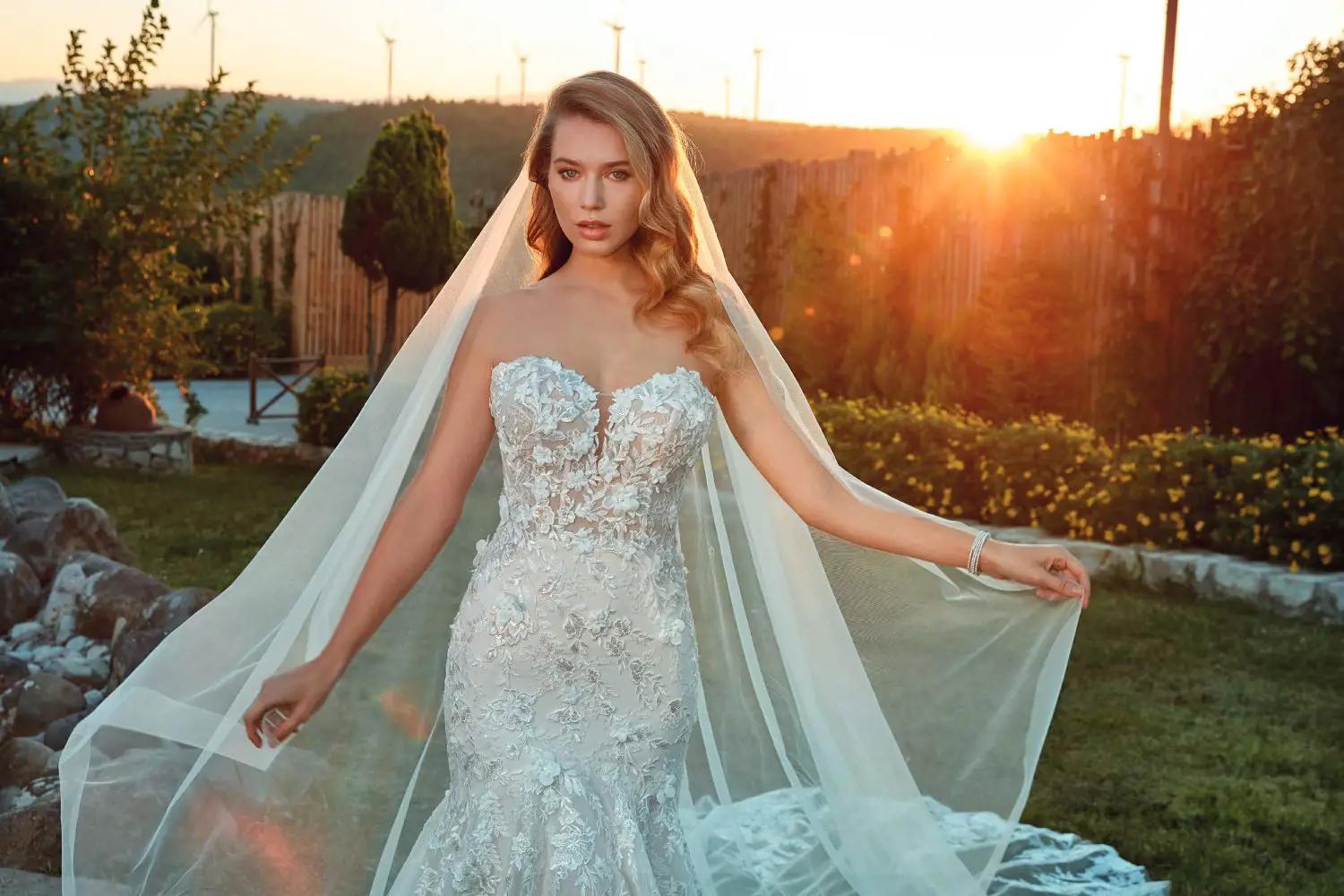 Model wearing a bridal gown at the grass