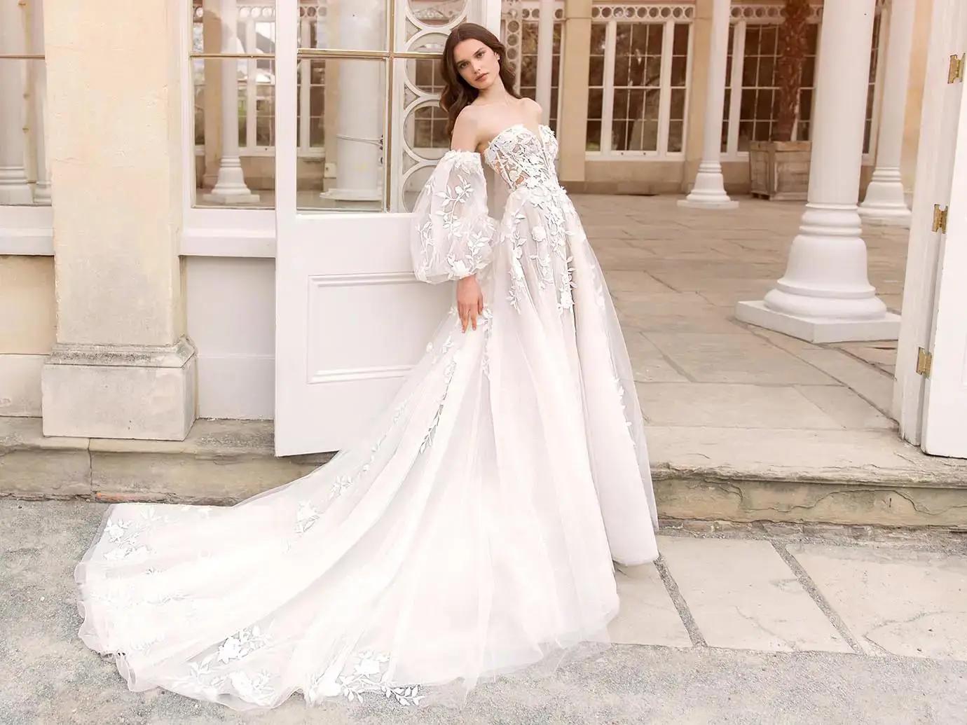 Model wearing Enzoani bridal gown