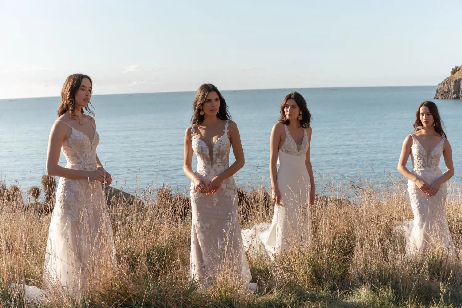 Models wearing a whate dresses on the grass