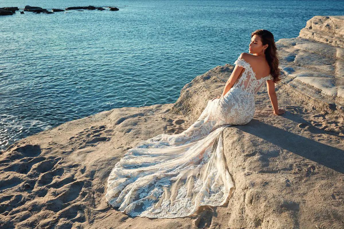 Model wearing a bridal dress on the beach