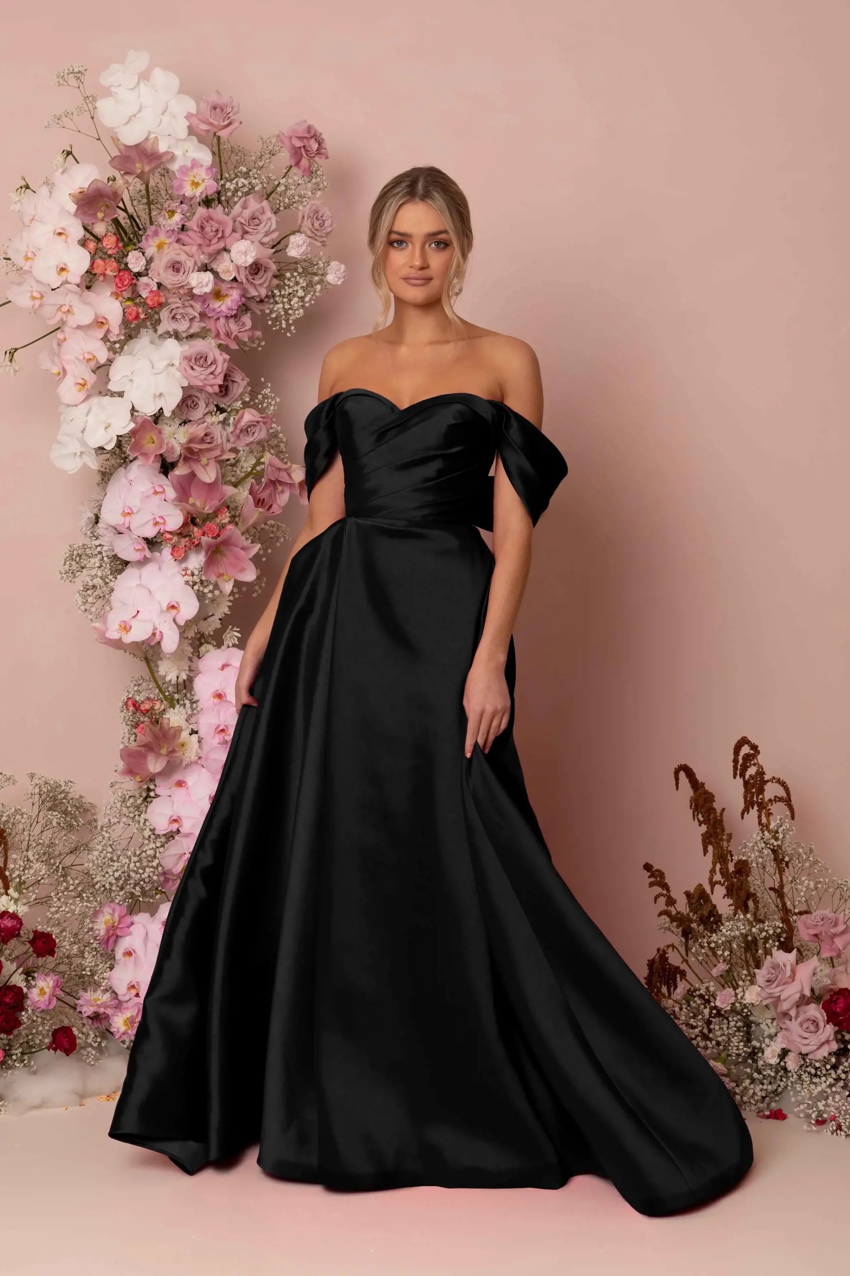 Model wearing a black dress