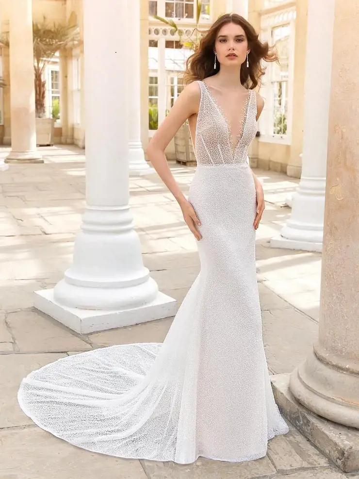 Model wearing a white dress
