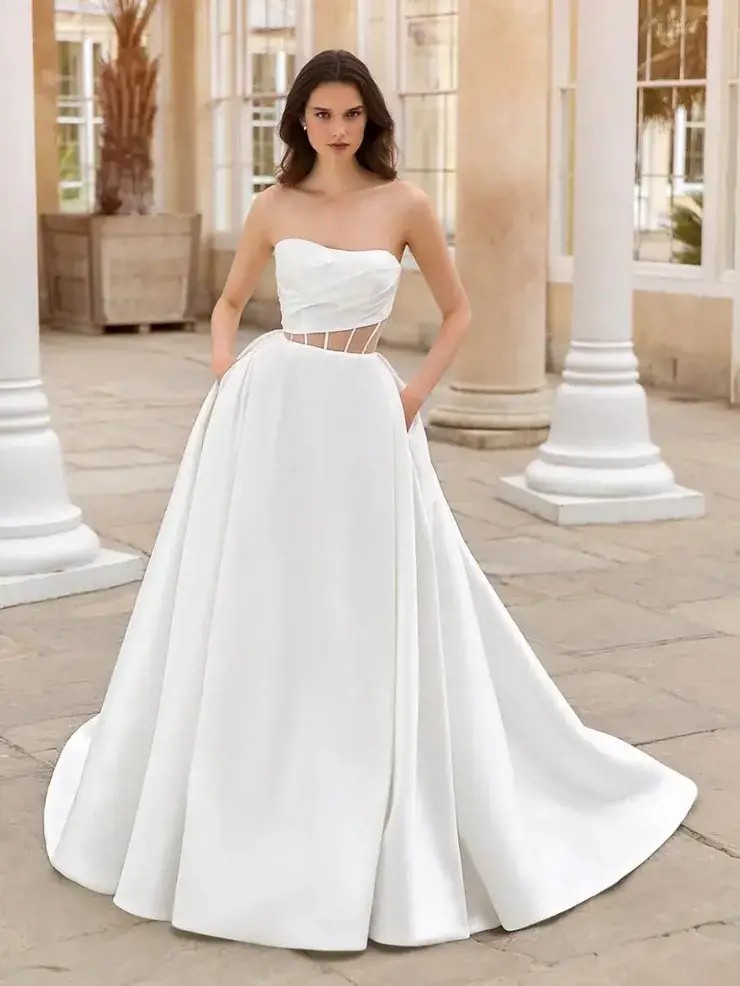 Model wearing a white gown