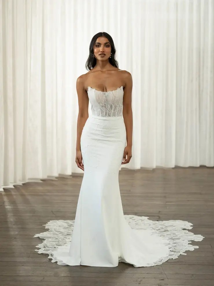 Model wearing a white dress
