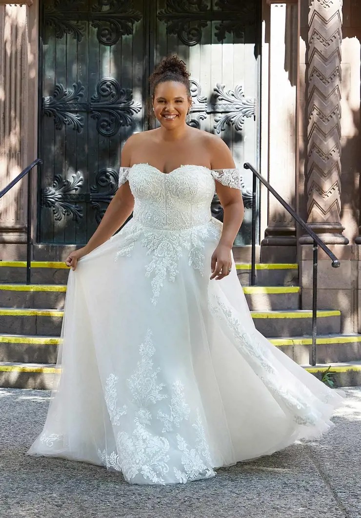 Model wearing a white gown