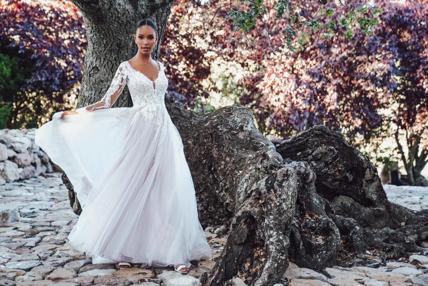 Model wearing a bridal gown under the tree